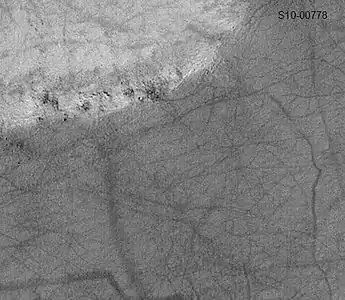 Pattern of large and small tracks made by giant dust devils as seen by Mars Global Surveyor, under the MOC Public Targeting Program.  Image is located in Eridania quadrangle.