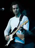 Dweezil Zappa playing the guitar