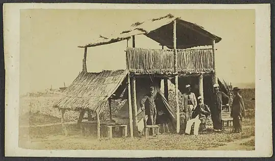 Dry ground must have been a rare luxury — notice where the tent is pitched