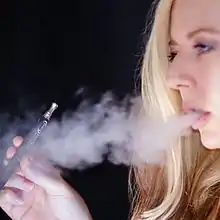 Aerosol (vapor) exhaled by an e-cigarette user.