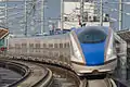 A JR East E7 series train on the Hokuriku Shinkansen