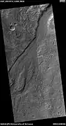 Streamlined shape in old river valley, as seen by HiRISE under HiWish program.  The streamlined shape is evidence of running water.