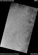 Wide view of defrosting, as seen by HiRISE under HiWish program Gas and dark dust is probably being blown out of ground and then carried by winds toward the Northwest.