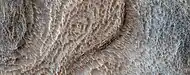 Close, color view of honeycomb terrain, as seen by HiRISE under HiWish program
