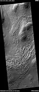 Wide view of hollows, as seen by HiRISE under HiWish program  Hollows may be formed as ice leaves the ground.