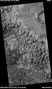 Wide view of field of mounds near pedestal crater, as seen by HiRISE under HiWish program