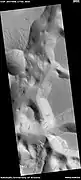 Minio Vallis, as seen by HiRISE under HiWish program Many dark slope streaks are present.