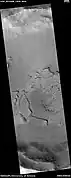 Surface fractured into mesas, as seen by HiRISE under HiWish program  Some of the mesas appear to have moved apart and rotated.