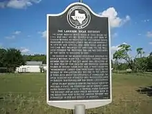 Photo shows a Texas state historical marker labeled The Lakeside Sugar Refinery.