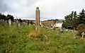 The remains of a monumental cross in the centre of the cemetery