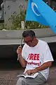 Uyghur man with the flag