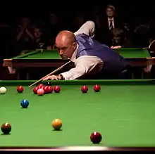 Peter Ebdon playing a shot