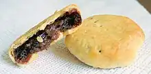 Image 52Eccles cake is a small round flaky pastry cake filled with currants, sugar and spice. It is native to Eccles. (from Greater Manchester)