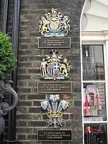 The Royal Warrants held by Ede & Ravenscroft displayed at their Burlington Gardens shop