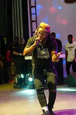 Edem performs at a concert.