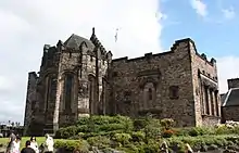 Scottish National War Memorial from the north, showing the shrine. The niche statue is 'Truth' by Alice Meredith-Williams and niche capitals by Phyllis Bone.