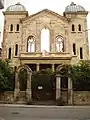 Facade of the ruined Synagogue before restoration