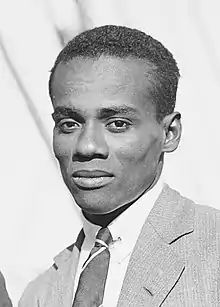 A headshot of a man in a cricket cap