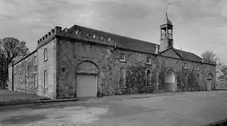 A view from the south of the estate offices and stables