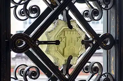 A glass cabochon decorating the wrought iron gateway