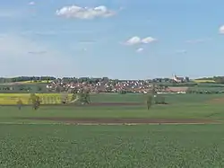 General view of the village from the south. Church of Saint Stephen to the right.