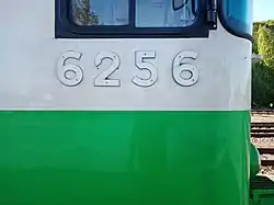 Close-up of the number plate of Eioc trailer No. 6256, seen at Kotka Port in June 2022. This unit, like most nowadays, carries the newer white livery with green lower bodyside band.