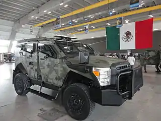 A Mexican SandCat as supplied by Oshkosh Defense. The similar-looking SandCat MX and DN-XI are not related to the Plasan or Oshkosh products in any way.