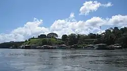 Color photograph of the village of El Castillo in southern Nicaragua as viewed from the San Juan River in February 2011