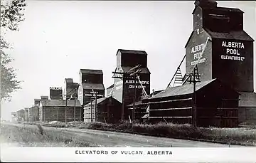 View of the row of grain elevators in Vulcan after 1920