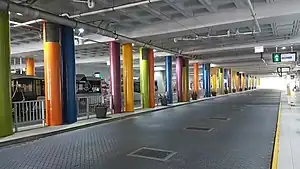 Bus road with concrete concourse deck above