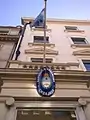 The Argentine flag and coat of arms outside the embassy