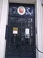 The entrance to the embassy depicting the Coat of arms of Finland