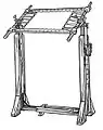 Free-standing embroidery frame with fabric attached