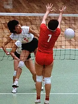 Women competing at volleyball