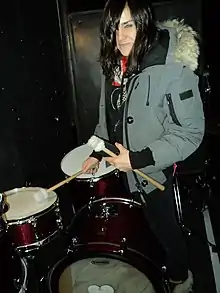 Emily Wells tuning her drum kit shortly before her sold-out show at The Neurolux