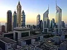 Image 8A view of the Emirates Towers in Dubai. The towers are the tallest two buildings on the right.