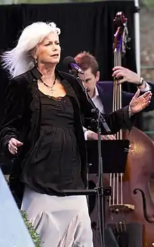 Emmylou Harris singing at a national park.