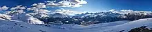 Panorama of the Upper Engadine from Muottas Muragl, showing peaks Piz Muragl, Piz Julier and Piz Ot, as well as St. Moritz town and Celerina