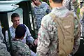 Cpl. Erikon C. Rosamond (left) of the US Marines and Royal Bermuda Regiment soldiers at Camp Lejeune in 2013