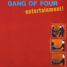 A red background with "Gang of Four" in all capitals and "Entertainment!" in all lowercase written at the top of the image. Three pictures of a cowboy shaking hands with an indigenous American are shown in the right to bottom-right of the image, with the surrounding text saying "The Indian smiles, he thinks that the cowboy is his friend. The cowboy smiles, he is glad the Indian is fooled. Now he can exploit him."