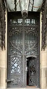 The glass and metal entrance of the palace