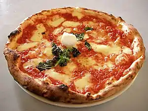 Pizza is a Neapolitan dish and one of the world's most popular fast foods