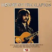 Photograph of Eric Clapton from the waist up playing a guitar, with "HISTORY OF ERIC CLAPTON" in large letters above, and a list of track titles in small letters below