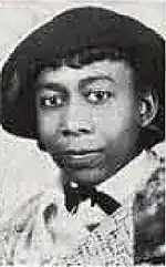 Portrait of a young black woman wearing a hat