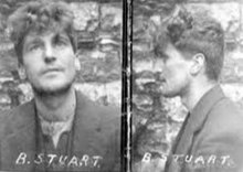 "Small black and white profile photograph of O'Malley, with the letters "B Stuart" written by hand across the bottom, taken in front of a wall; front and side view of his face shown with thick wavy hair"