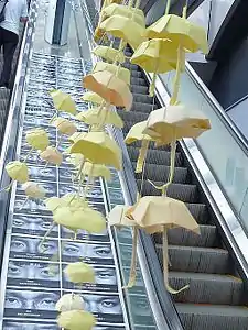 Origami mobile and escalator eyes (Umbrella Square)