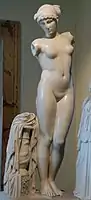 The Esquiline Venus, 1st century AD Roman copy of a late Hellenistic artwork from the 1st century BC, with a snake depicted on the vase at the base and a woman wearing a royal diadem.