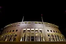 Night view of the facade of a Stadium.