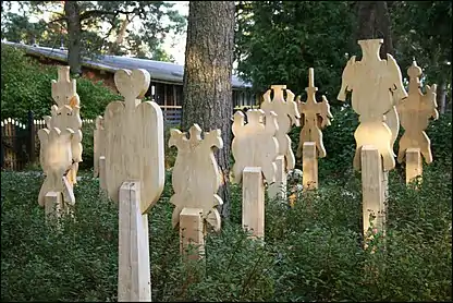Restored Kursenieki wooden grave markers at Nida cemetery