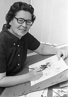 Photograph of Etta Hulme at drawing board